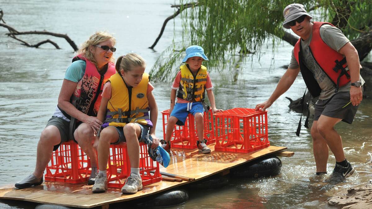 2014 Gumi Race: Unsure about the seaworthiness of "The Maharg" are the Graham family of Wagga Cheryl, Kelli, 9, Tyler, 5, and Kim. Picture: Michael Frogley