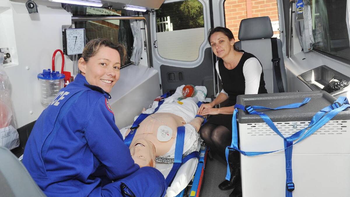 TRAINING PUSH: (From left) Paramedic Renee Heinrich and intensive care nurse Kylie Plemming were among a group of Wagga health professionals who yesterday got a look into a new emergency simulation training vehicle called RivSim at the University of NSW’s Rural Clinical School.  	Picture: Alastair Brook