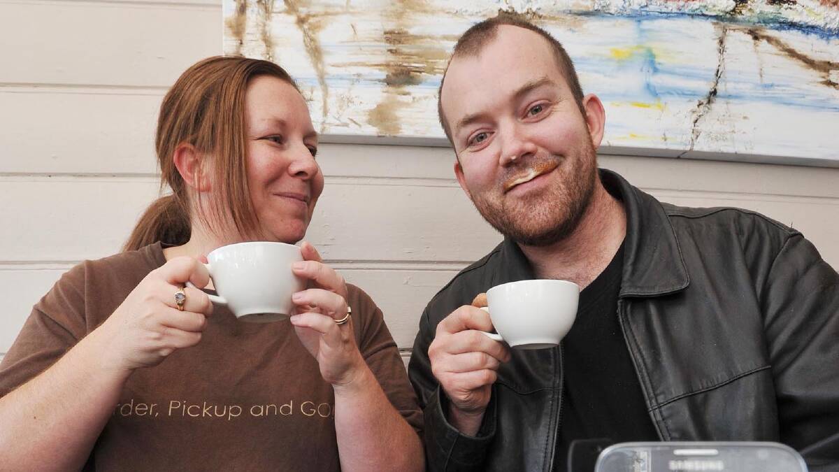 FROTHING: 365cups app co-founder Simone Eyles (left) shares a coffee with Ben Pritchard, owner of Trail Street cafe, Premium Coffee Roasters. Mr Pritchard was the first to jump on board to use the app, which has expanded to more than just coffee since its launch in January 2011. 		           Picture: Alastair Brook