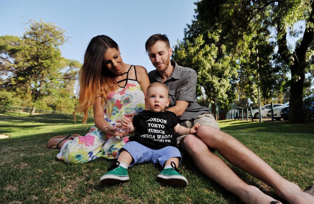 FAMILY VALUES: Wagga residents Teisha Robinson, Matt Snowden and their son Khan, 1, enjoy a day out at the Botanic Gardens. Yesterday, a new Suncorp Bank report named Wagga the most family-friendly city in Australia.  Picture: Alastair Brook 