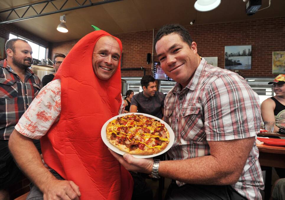 Fire in the Hole chilli pizza eating contest at The Thirsty Crow. Dan Kelly and Rhys Blackburn. Picture: Alastair Brook
