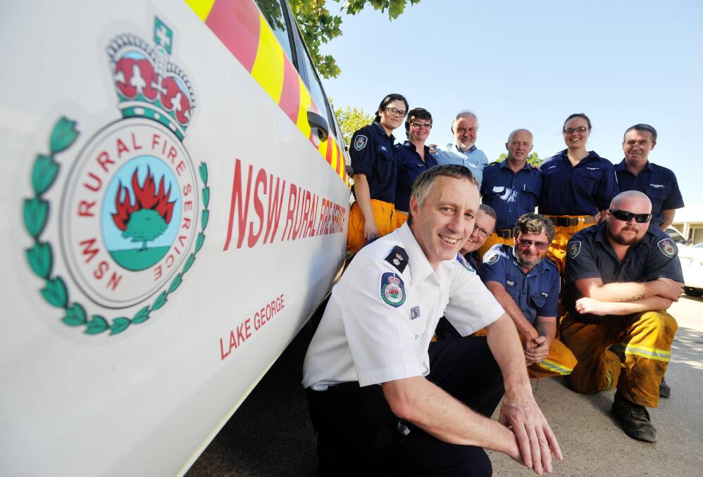 Celebrating a job well done after the recent bushfires are (front) Superintendent Roger Orr, Mick James, Allen Ryan, Jake Ridley, (back) Amanda O'Connor, Senior Deputy Nicole Clark, Wagga Mayor Rod Kendall, Captain David Doblinger, Anna Di Pauli and Peter Raby. Picture: Alastair Brook