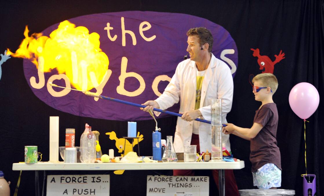 The Jollybops science show at the Wagga Marketplace last Wednesday, featuring Rusty the Robot and the Jolly Wizard. Sam Bailey, 12, of Wagga turns up the heat. Picture: Les Smith