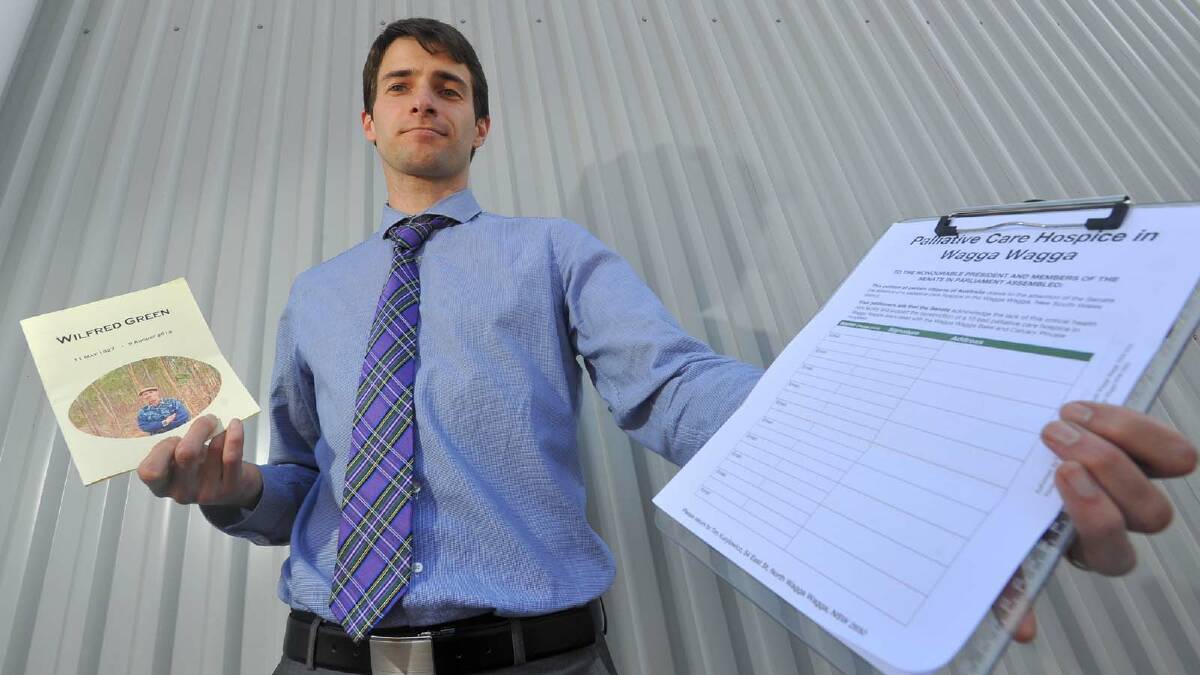 PALLIATIVE PETITION: Country Labor candidate Tim Kurylowicz stands with his petition to bring public palliative care services to the city. 	Picture: Addison Hamilton