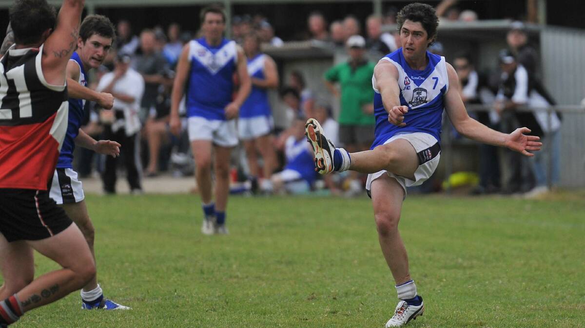 Justin Driscoll kicks for TRYC at Victoria Park.