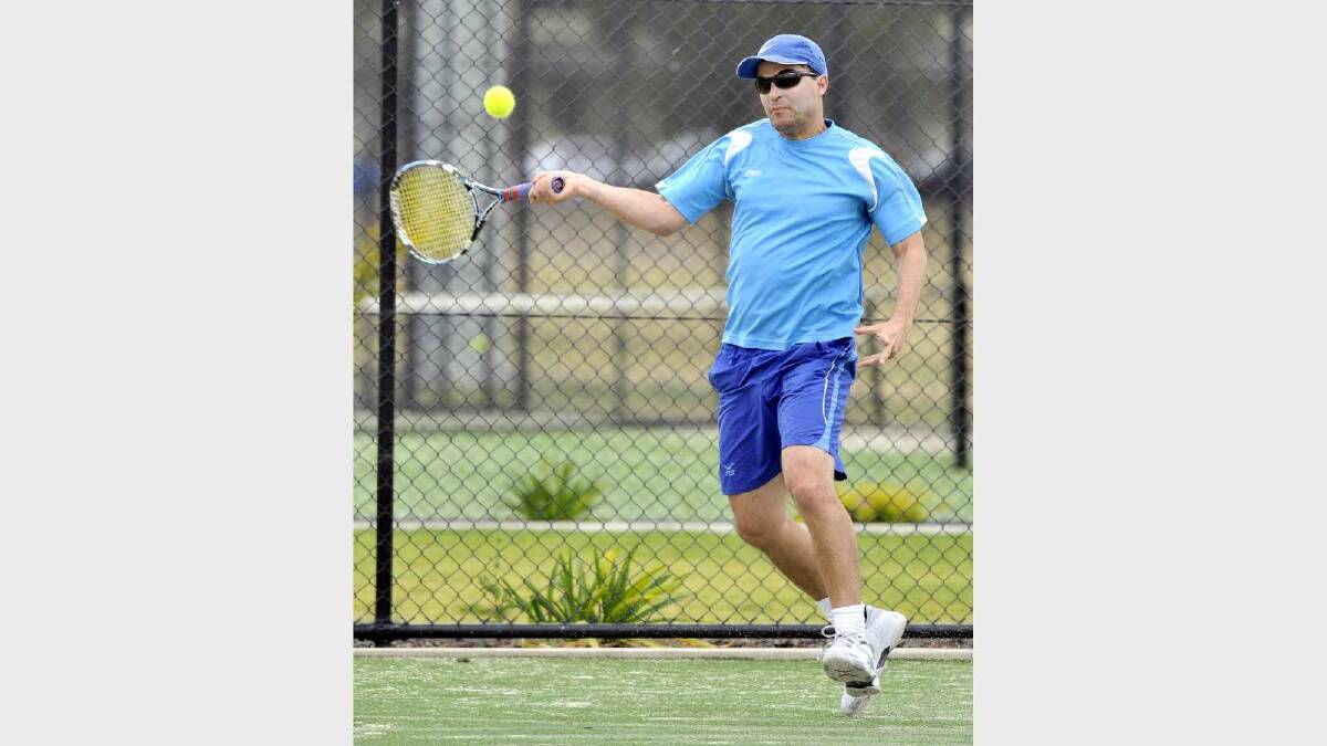 TENNIS: Pennant tennis at the Jim Elphick Tennis Centre. Wagga's Ciaran Moore smashes one in the men's number one match against Dane Mottley. Picture: Les Smith