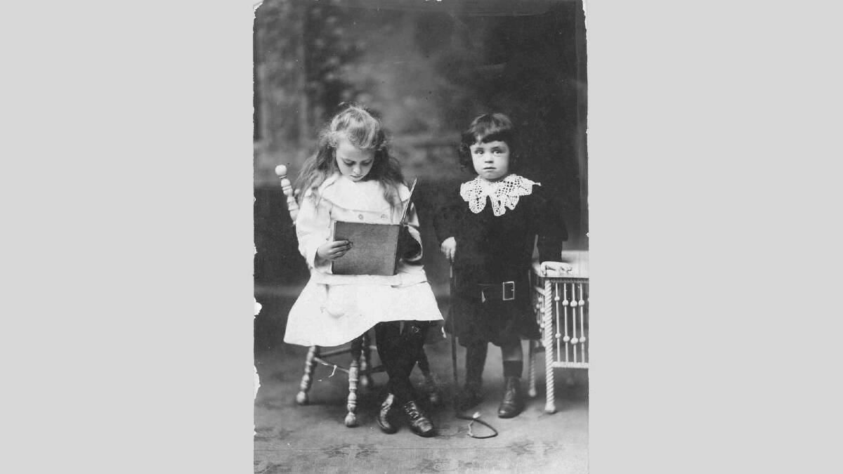 Children take time out to read. Picture: Wagga and District Historical Society