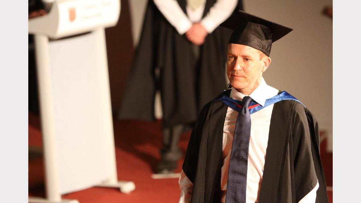 Graduating from Charles Sturt University with a Master of Information Systems Security with distinction is Andrew Brown. Picture: Daisy Huntly