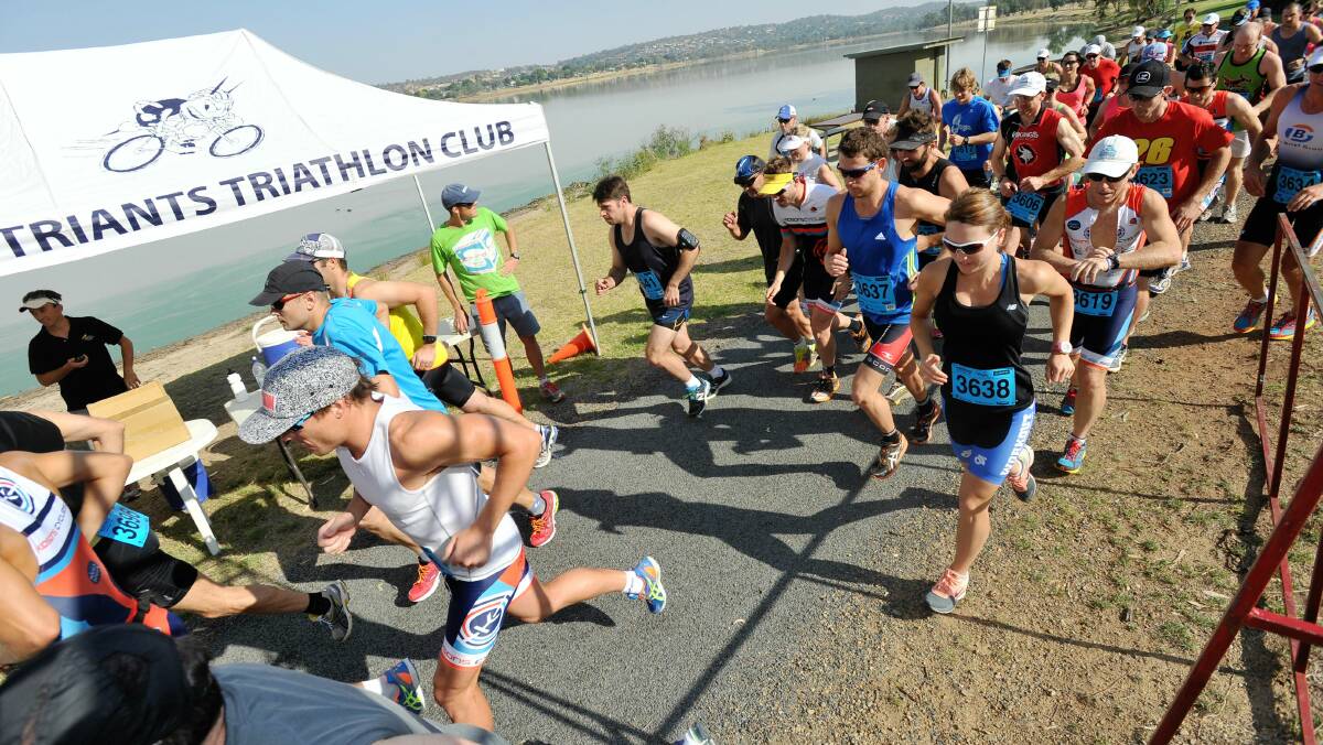 Wagga Triathlon Club's come-and-try duathlon: Male and female competitors take off from Apex Park. Picture: Alastair Brook