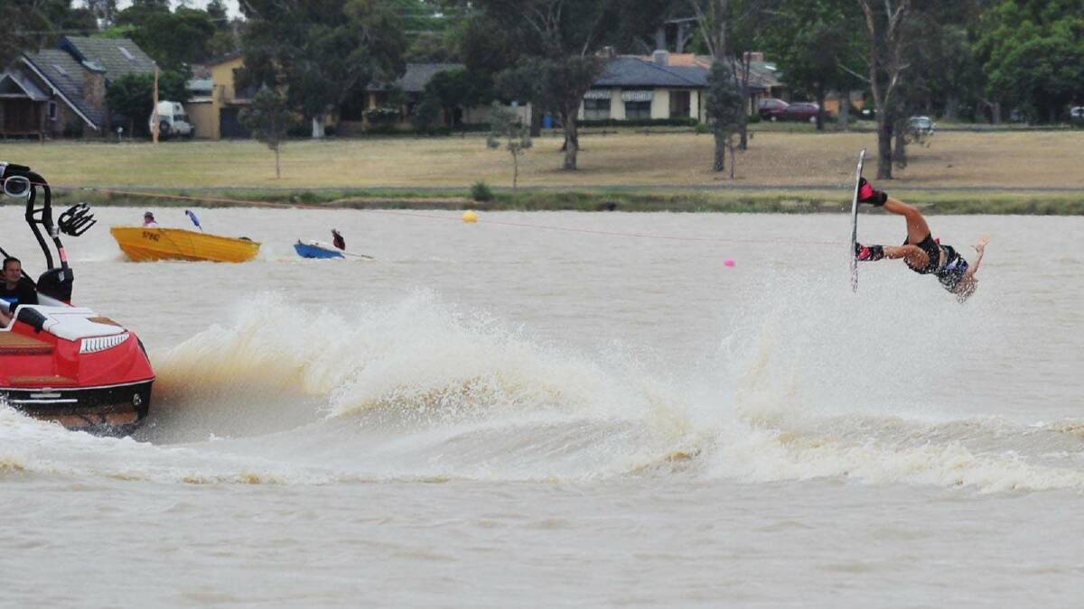 Caity Blaauw gets some air wakeboarding on Lake Albert. Picture: Alastair Brook