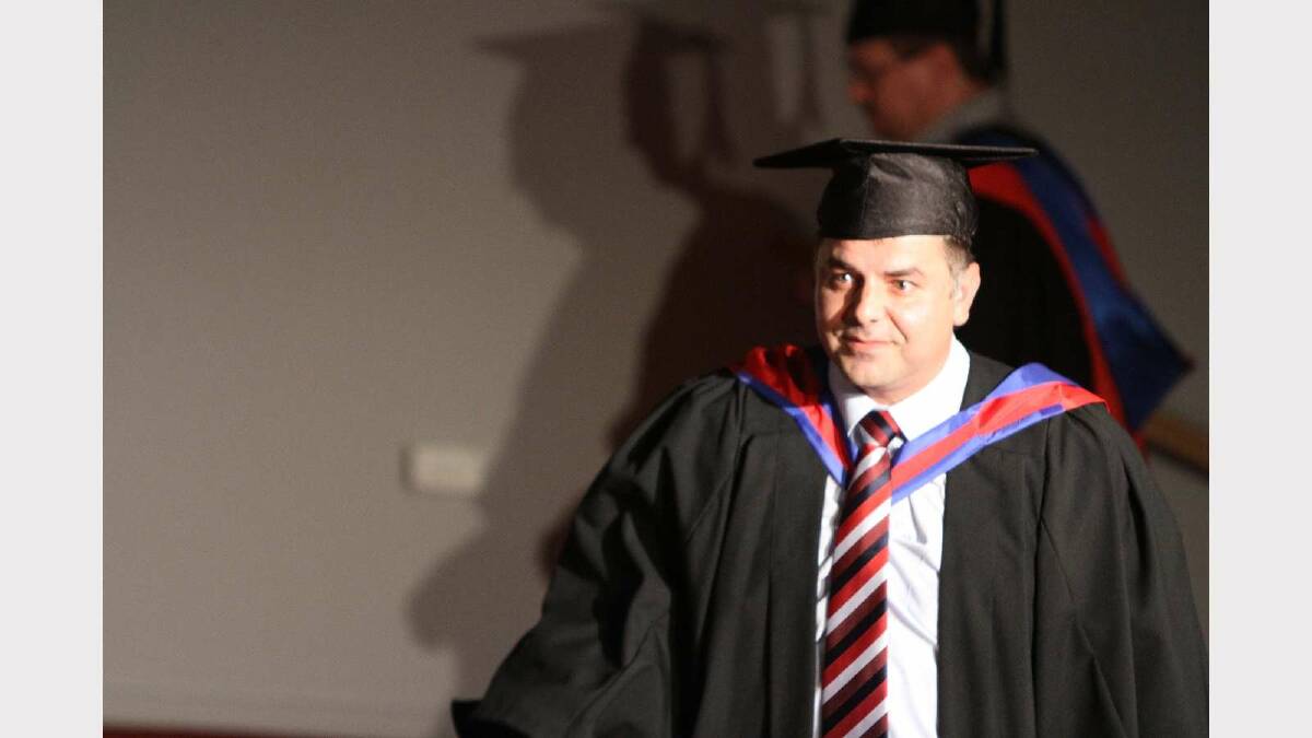 Graduating from Charles Sturt University with a Graduate Certificate in Management (Information Technology) is Cem Ozcan. Picture: Daisy Huntly
