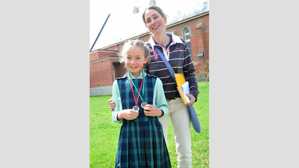 Tess Buckley (9) of Lutheran Primary School is congratulated by her mother Petra after her great performance. Picture: Michael Frogley