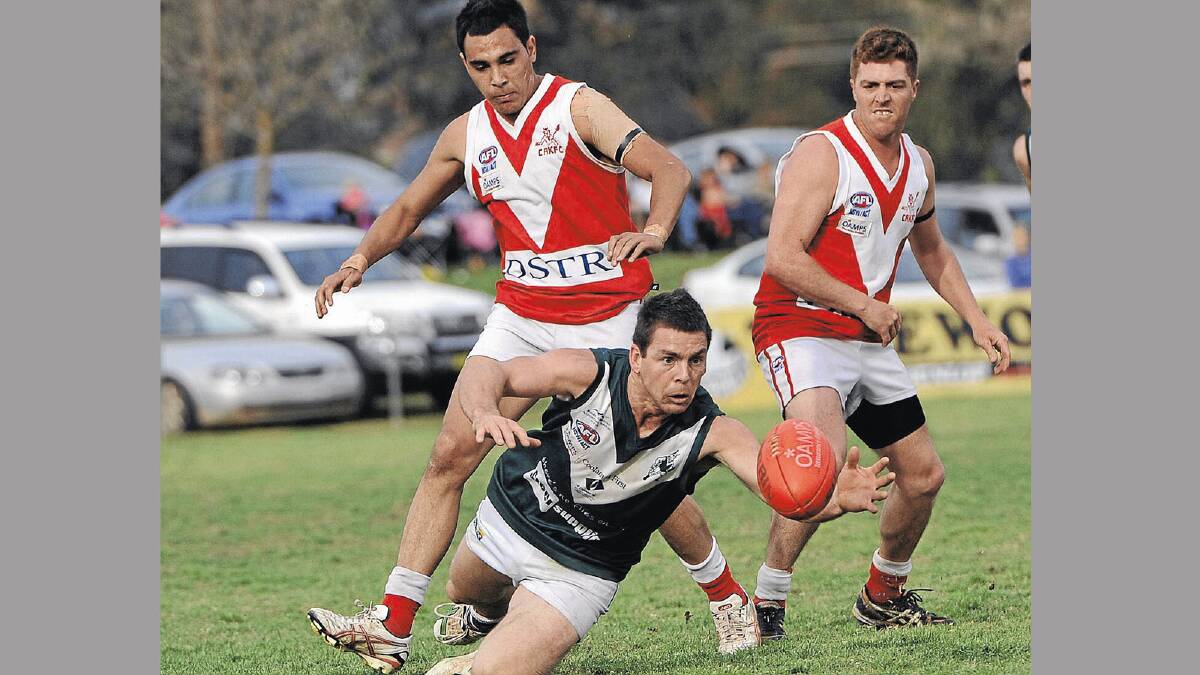 Coolamon is happy to have midfielder Ryan Chamberlain back in green and white colours this season after a year away. Chamberlain is pictured pouncing on the ball ahead of Collingullie-Ashmont-Kapooka's Jarrah Maksymow and Jamie Wild. Picture: Oscar Colman