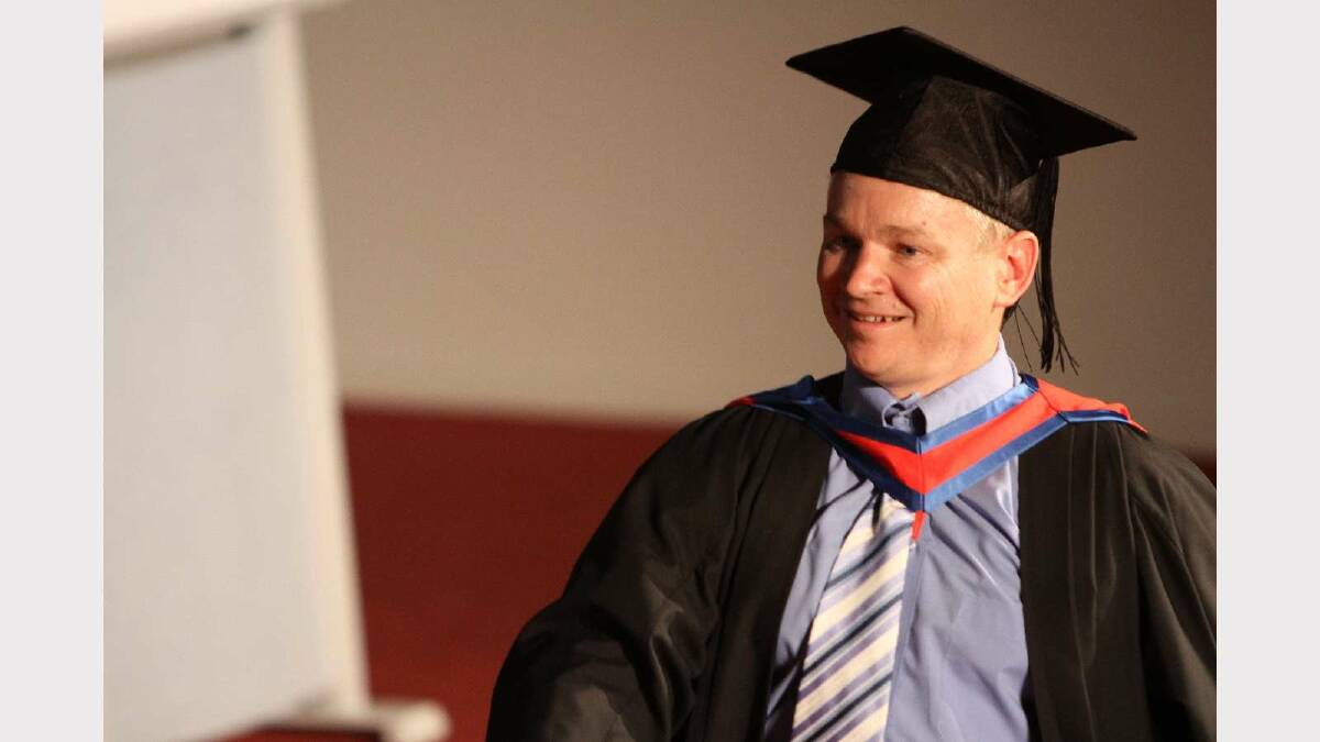 Graduating from Charles Sturt University with a Bachelor of Information Technology with distinction is Peter McCartan. Picture: Daisy Huntly
