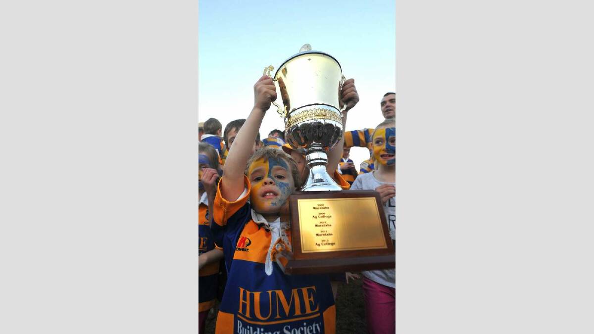 Albury Steamers took out the top honours of the day, defeating Waratahs 41-7. Lachlan Wheatley, 5, gets his hands on the trophy. Picture: Addison Hamilton