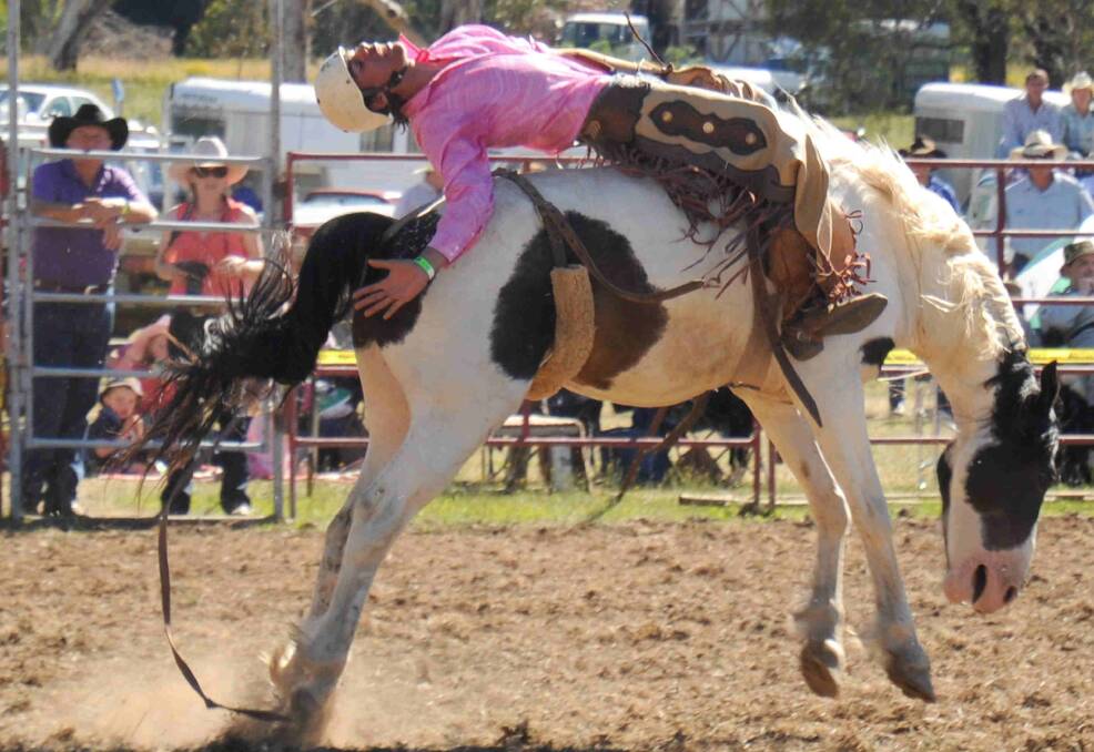 Jake Mallay-Murphy competes in the bareback ride at the Rosewood Rodeo on Saturday