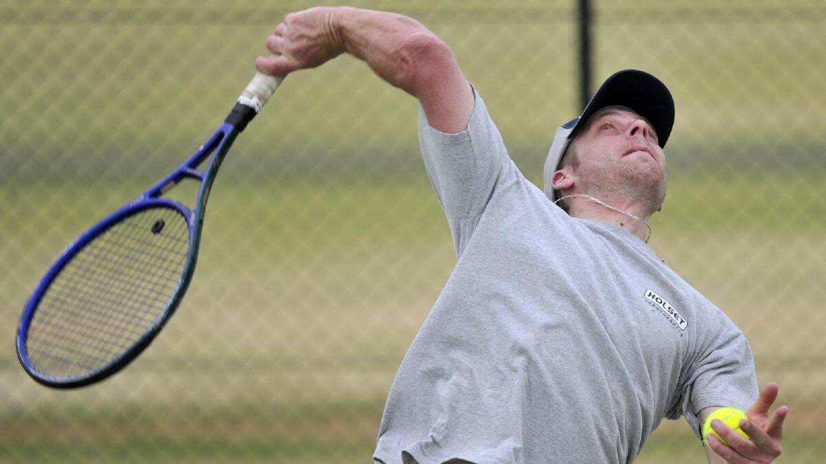 TENNIS: Pennant tennis at the Jim Elphick Tennis Centre. Dane Mottley serves during the men's number one match. Picture: Les Smith