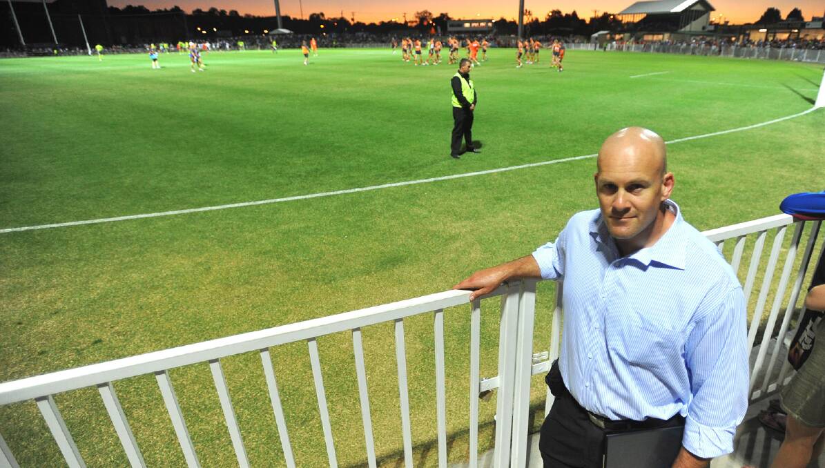 Wagga City Council strategic planner Jarrod Bryant looks out over the finished product of Robertson Oval during Saturday night’s NAB Cup clash. Pictures: Addison Hamilton