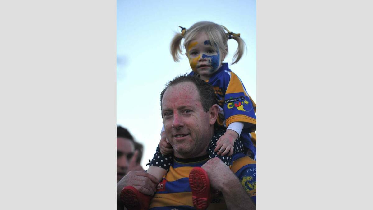 Albury Steamers took out the top honours of the day, defeating Waratahs 41-7.  Mick Alexander with his daughter Asha, 2. Picture: Addison Hamilton