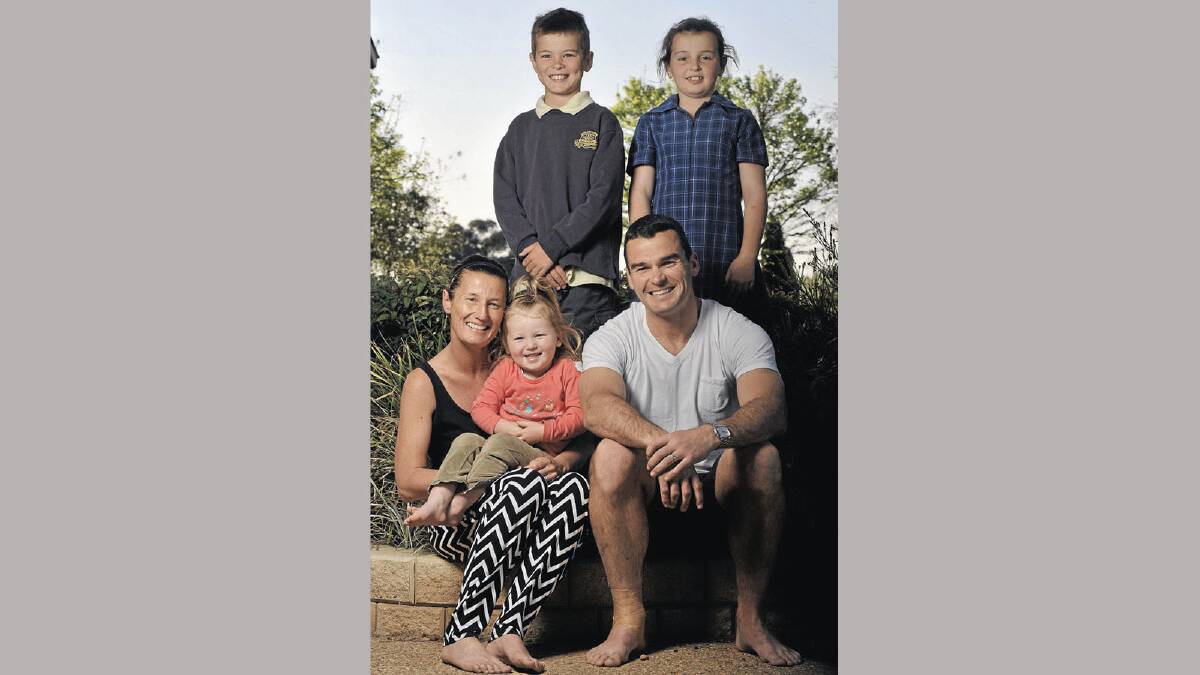 OFF SEASON: Southcity captain-coach Daniel Fitzhenry relaxes at home with wife Sloane and children Lachlan, 9, Amali, 7, and Molly, 2. Fitzhenry is pondering the Group Nine premiership in 2013 without Bulls star Kyle McCarthy. Picture: Michael Frogley