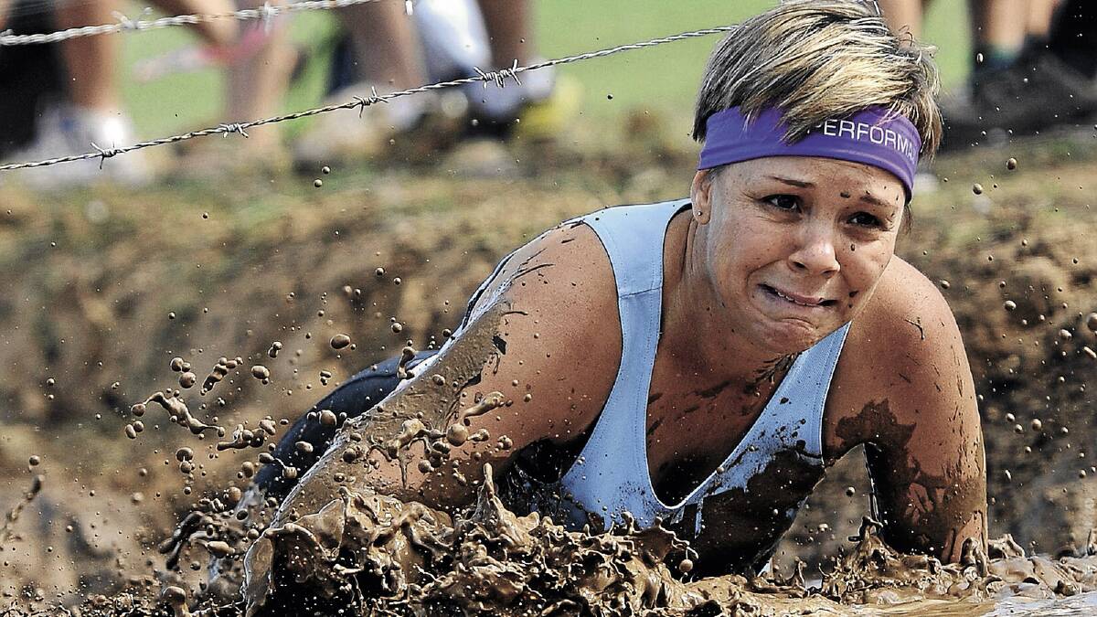 Kellie Murray tackles one of the obstacles during the Mud, Sweat and Beers event near Euberta on Saturday. Picture: Michael Frogley