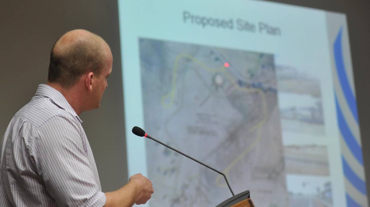 Senior town planner Steven Cook highlights the proposed site plan for the Riverina Motor Complex at a public meeting last year. Picture: Oscar Colman