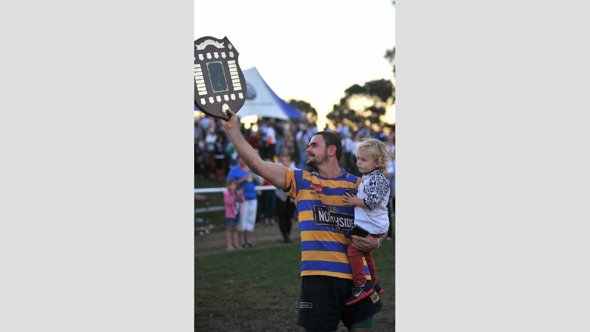 Albury Steamers took out the top honours of the day, defeating Waratahs 41-7. Albury's Liam Krautz took the man of the match award and celebrated with son Hugo, 2. Picture: Addison Hamilton