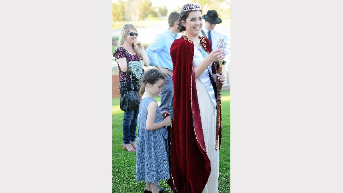Miss Wagga 2014 crowning ceremony. Jane Morton's sister makes sure her cape stays clean.  Picture: Jacinta Coyne