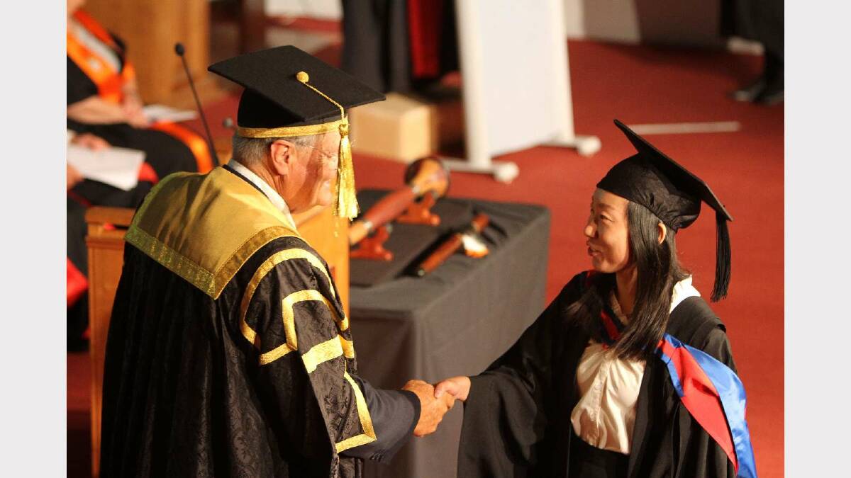Graduating from Charles Sturt University with a Bachelor of Business Studies is Tongmin Yu. Picture: Daisy Huntly