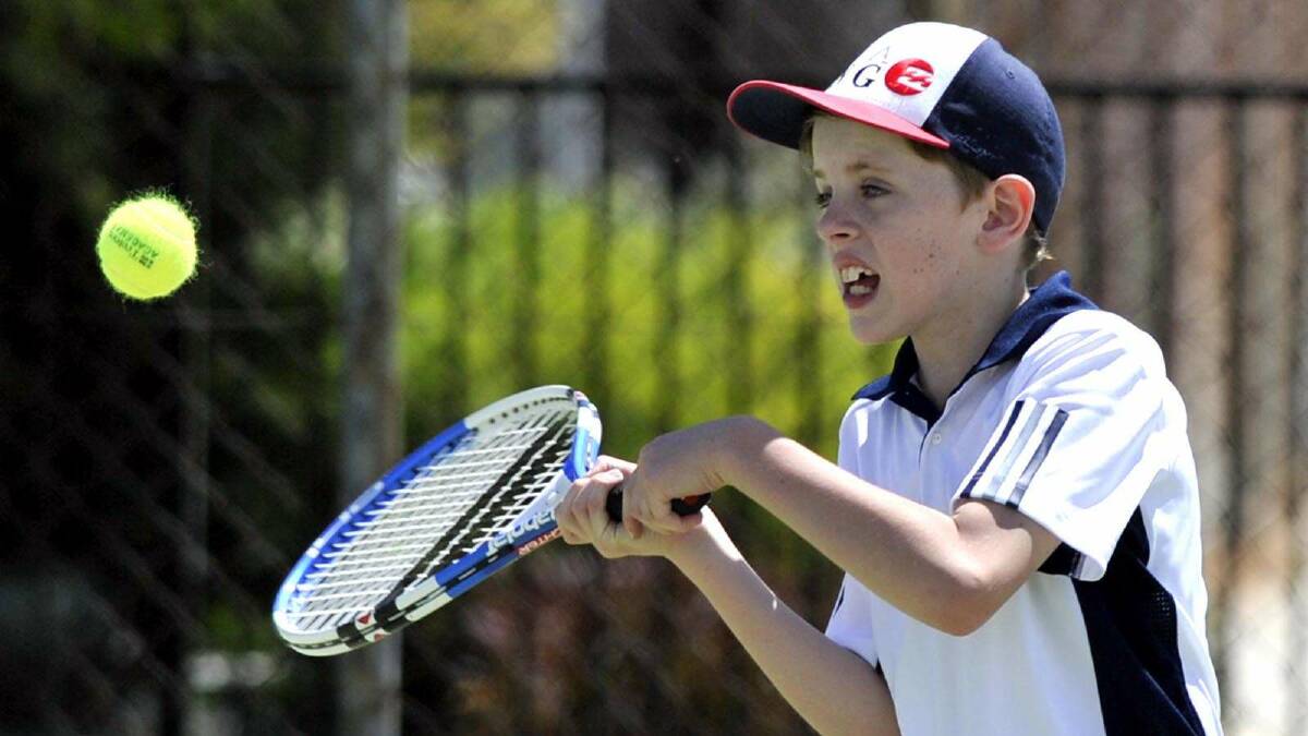 TENNIS: Junior tennis at Bolton Park. Joseph Bousfield, 10, gets in close to the ball. Picture: Les Smith