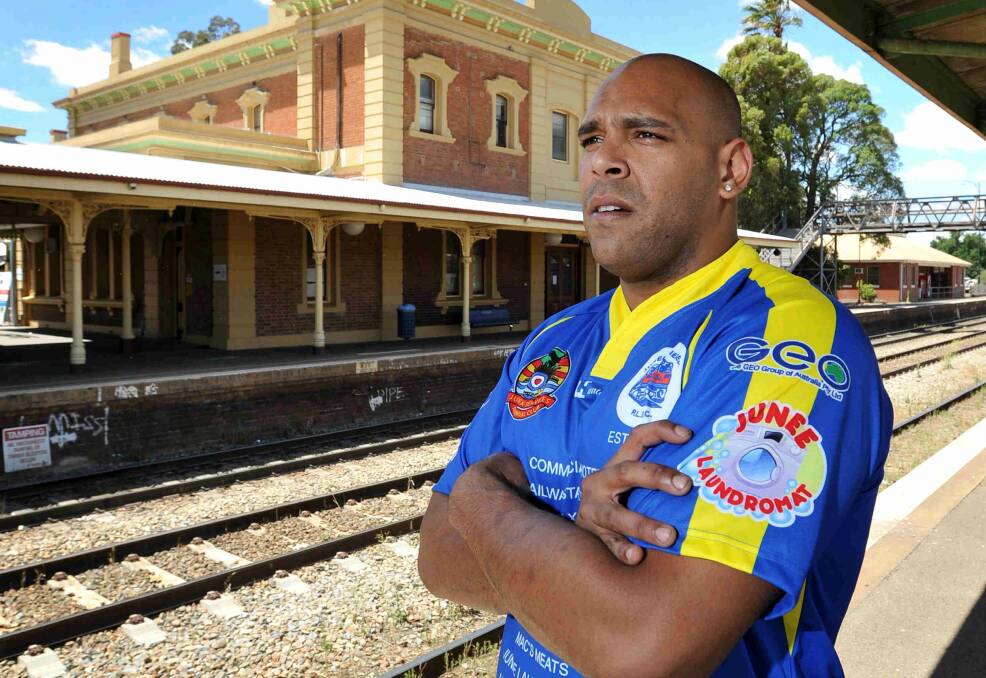 Man-mountain Patrick Sagigi gets a feel for Junee at the town's railway station