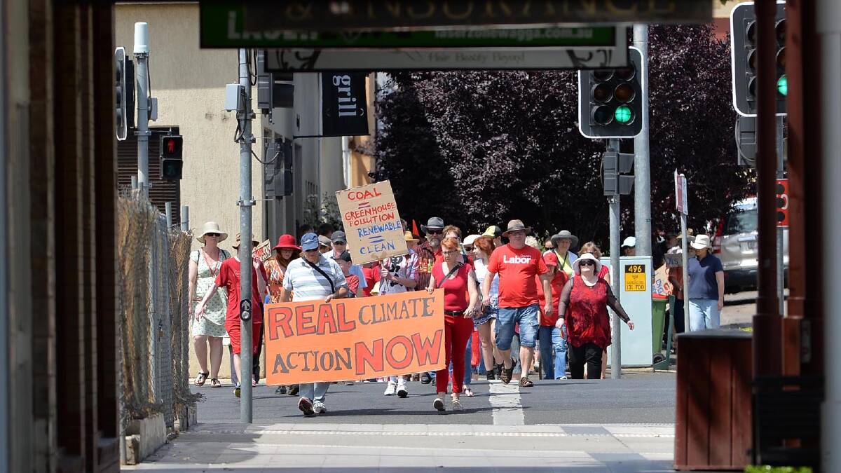 Protesters march down Baylis Street as part of a National Day of Action on Climate Change yesterday. Picture: Michael Frogley