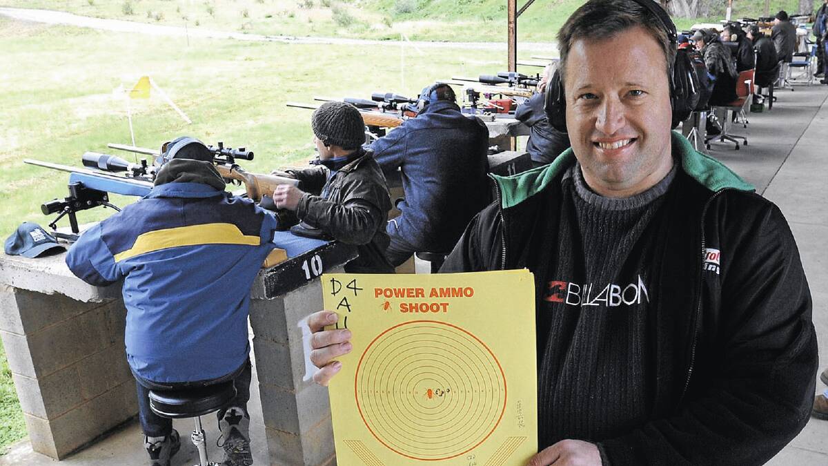 TOP SHOT: Batemans Bay shooter Anthony Hall shows off the target after his amazing performance at the Blue Heeler Classic at the Big Spring range on Sunday.  Pictures: Les Smith