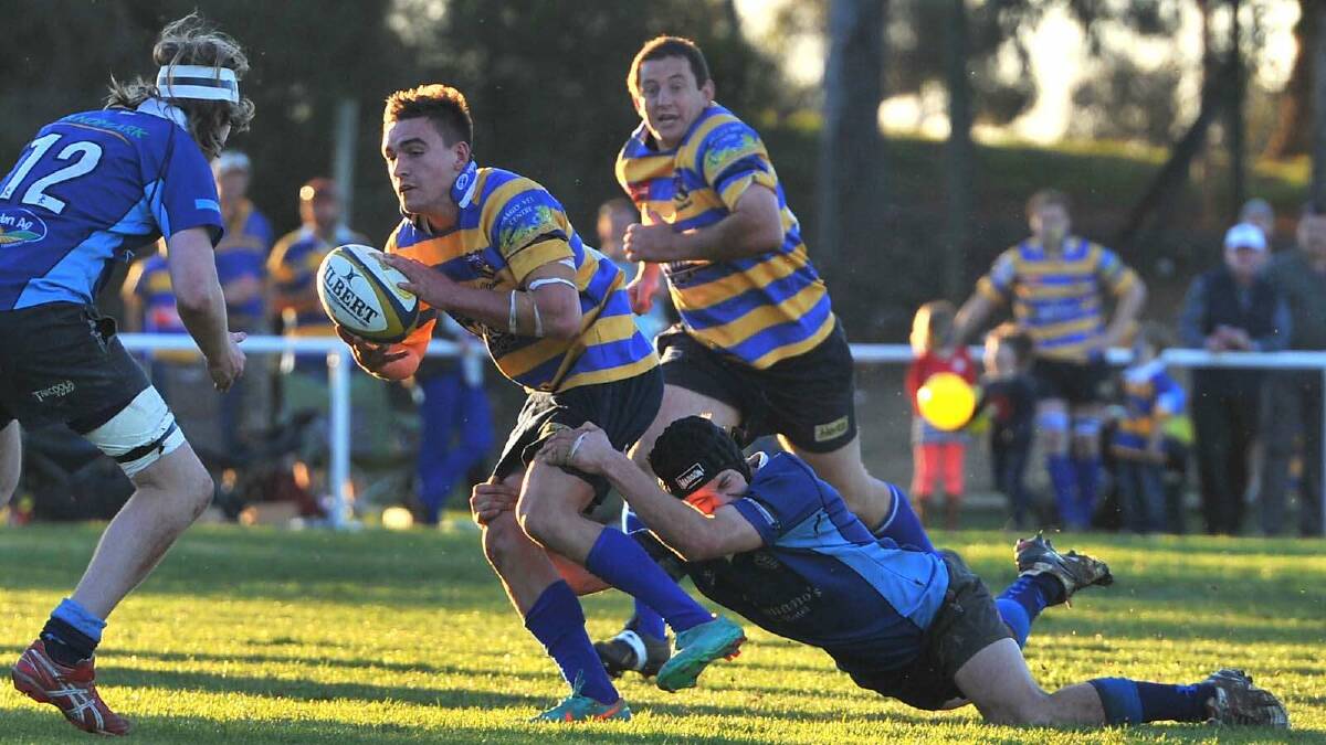 Albury Steamers took out the top honours of the day, defeating Waratahs 41-7. Albury's James Olds is brought down by Matt Binks. Picture: Addison Hamilton