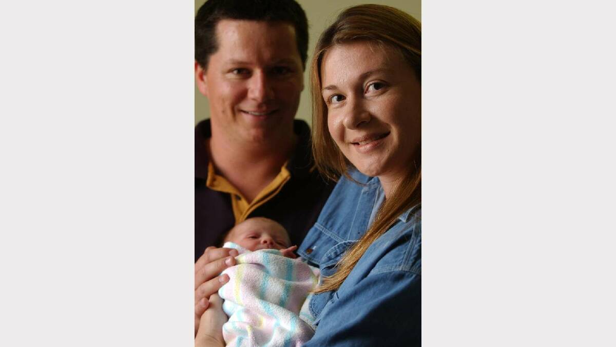 Tia Jane Lyons was right on time when she was born at 12.55am on New Year's Day 2002 at Calvary Hospital. Tia is pictured with parents Suzie and Gary from Wagga. Picture: Les Smith 