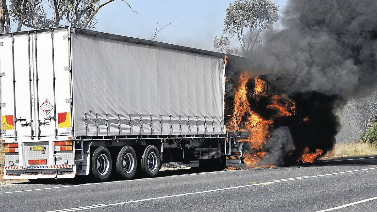 A fire ignited in a semi-trailer travelling on Goldfields Way – about 20 kilometres south of Temora – yesterday. Picture: Michael Frogley