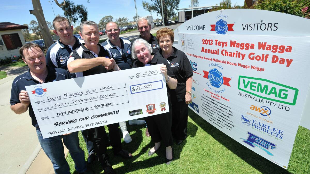 26,000 REASONS TO SMILE: (front from left) Teys purchasing manager Gary Boyd, general manager Andrew Ross, Ronald McDonald House Wagga (RMHW) executive officer Deborah Braines, RMHW board chairman Councillor Yvonne Braid, (back from left) Teys QA manager Adam Hughes, QT manager Haydon Cornell and RMHW fund-raising chairman Bill O�Rourke at yesterday�'s presentation from Teys to RMHW. Picture: Alastair Brook