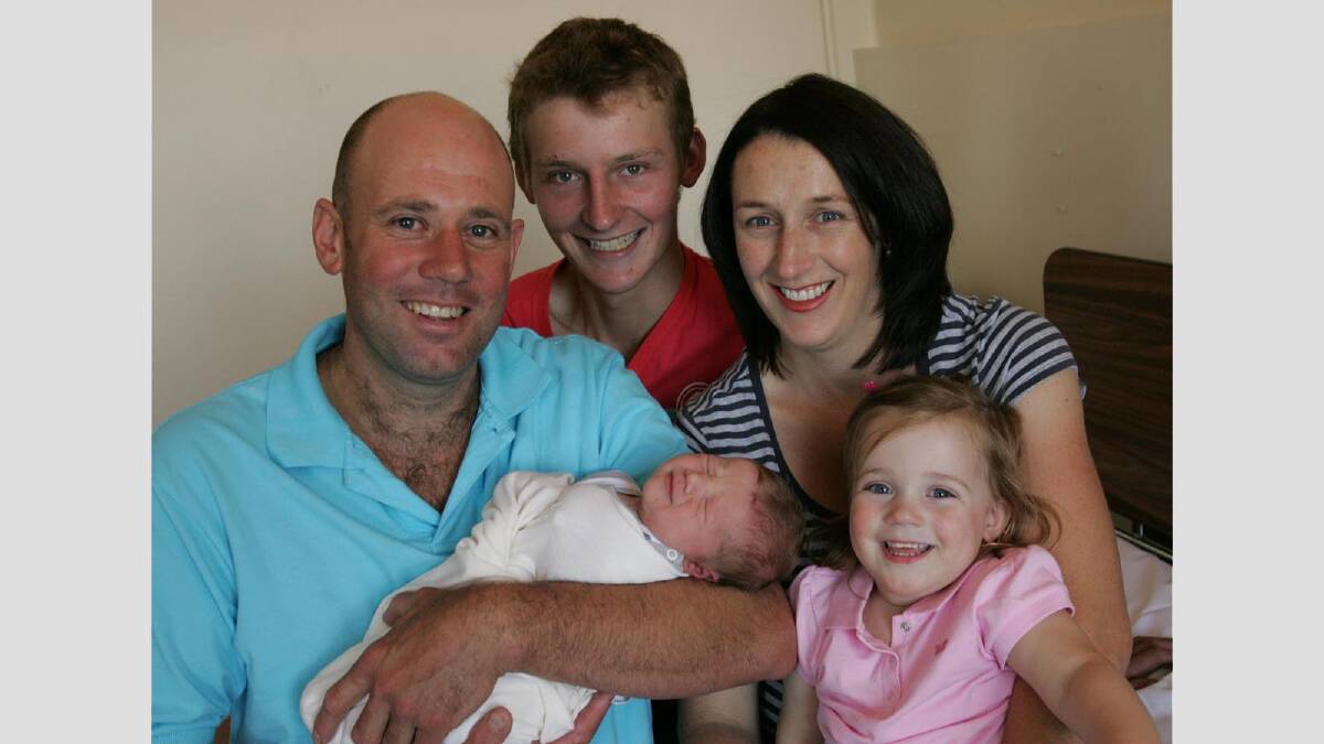 Charles William Hutton was one of six babies born in the first hour of 2009 across the country. Charles was born at 12.45am to parents Donna and Charles, and is also pictured with siblings Angus and Phillipa. Picture: Brett Joschel