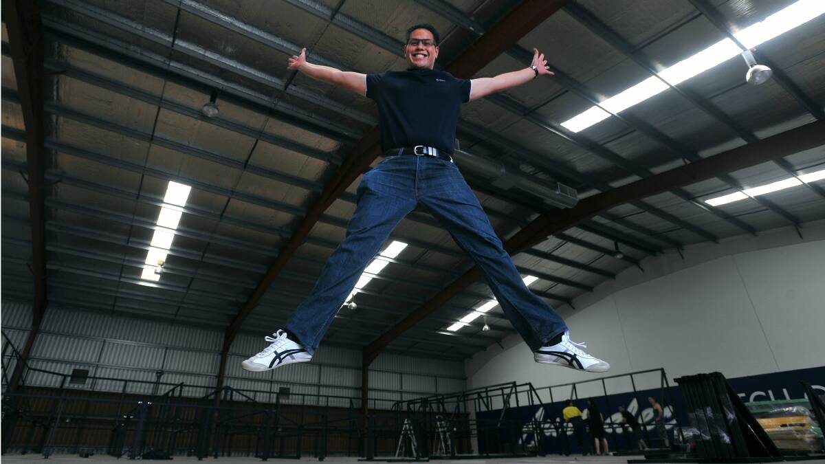 READY TO BOUNCE: Wes Fang prepares himself for the opening of Jump'n'Putt Trampoline in Nagle St in a matter of weeks. The facility will feature a massive 350 square-metre trampoline, a mini-golf course, party room and a small cafe. Picture: Addison Hamilton