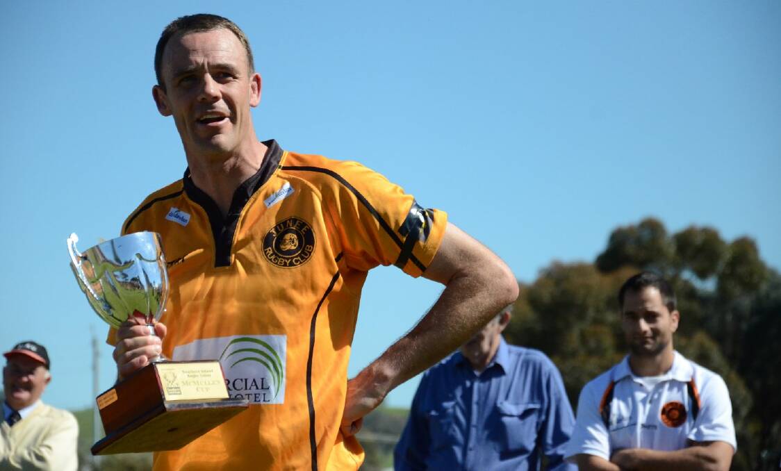 Rams captain Greg Condon holds the McMullen Cup after 3rd grade SIRU grand final. Picture: Declan Rurenga