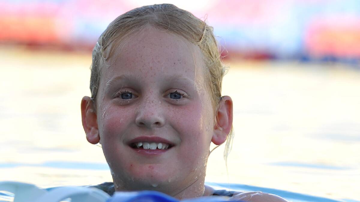 Maddison Piggott, 9, takes a quick dip at the Wagga Swimming Club Christmas Party at the Oasis. Picture: Michael Frogley