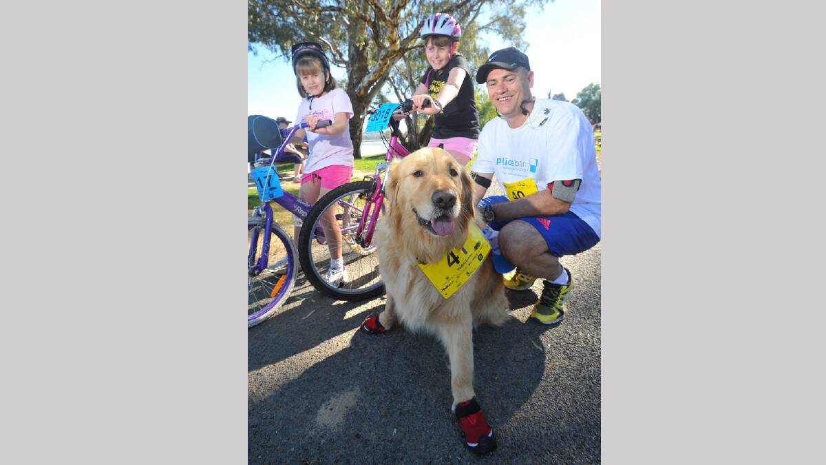 Lake to Lagoon 2013 - Chelsea Clark, 8, Brianna Clark, 11, and Sean Clark with their dog Bosco in his running shoes, ready for the run and ride. Picture: Addison Hamilton