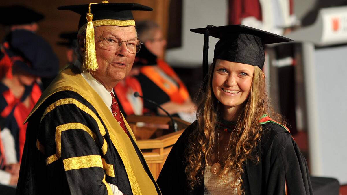 Recipient of the 2010 Kapooka-Legacy Scholarship Gemma Lord congratulated by Chancellor Lawrence Willett on her Bachelor of Arts/Bachelor of Teaching (Secondary) with Distinction. Picture: Michael Frogley