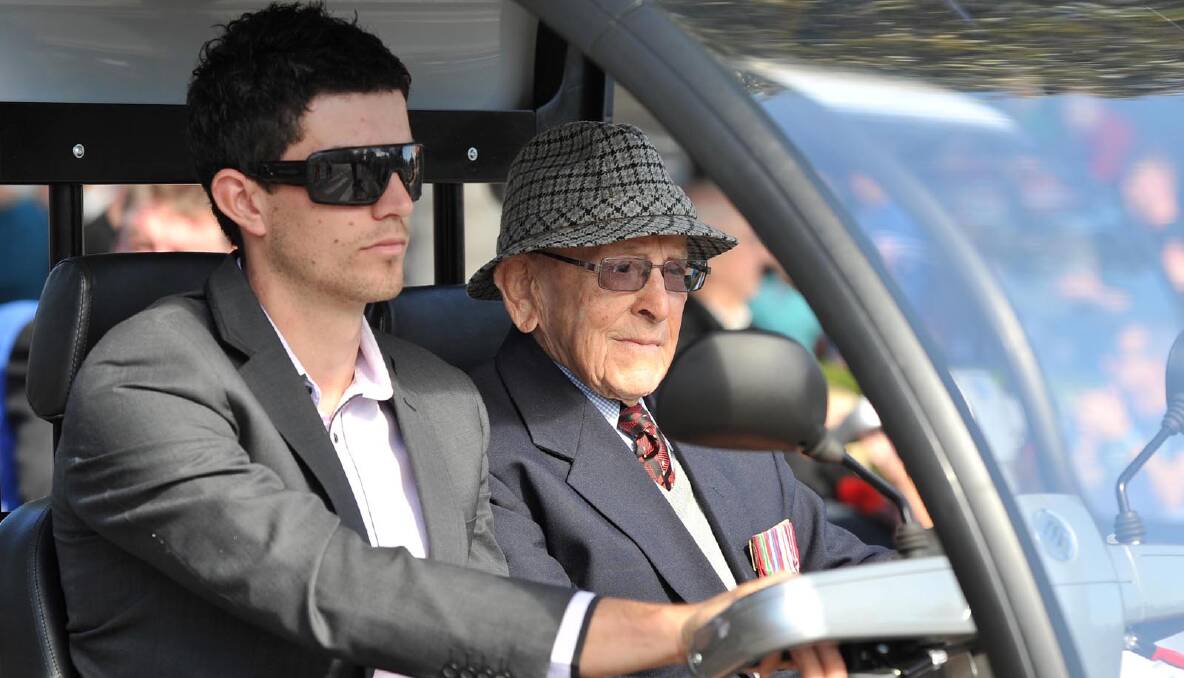  Rohan Pearce driving his grandfather Dick Jourdain in the Anzac Day march in Wagga. Picture: Michael Frogley