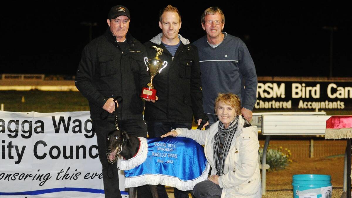 Victorian trainer Michael Carter (left) and Jimmy Lane is congratulated by Brett, Darren and Kay Hull after the Graeme Hull Memorial Wagga Cup final (525m) at Wagga Showground. Picture: Alastair Brook