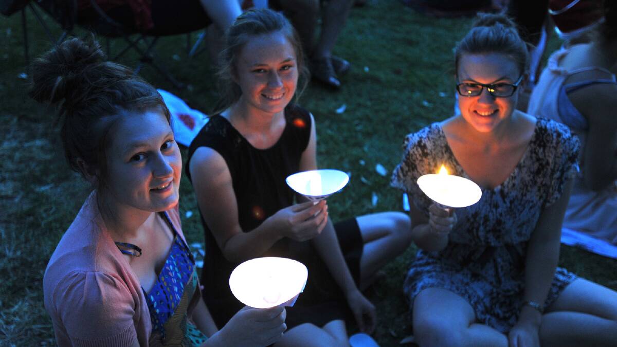 Jo Gibbs, Cheyne Gibbs, Amy Gibbs relaxing by candlelight at the Wagga Christmas Spectacular. Picture: Addison Hamilton