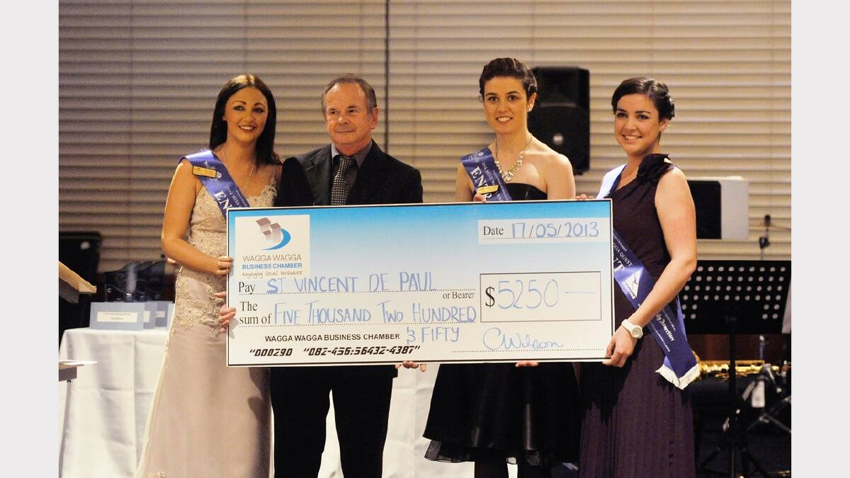 Miss Wagga entrants Kathryn Brooks, Samantha Brunskill, Jane Morton presenting a cheque to St Vincent de Paul's at the Crow Awards. Picture: Alastair Brook