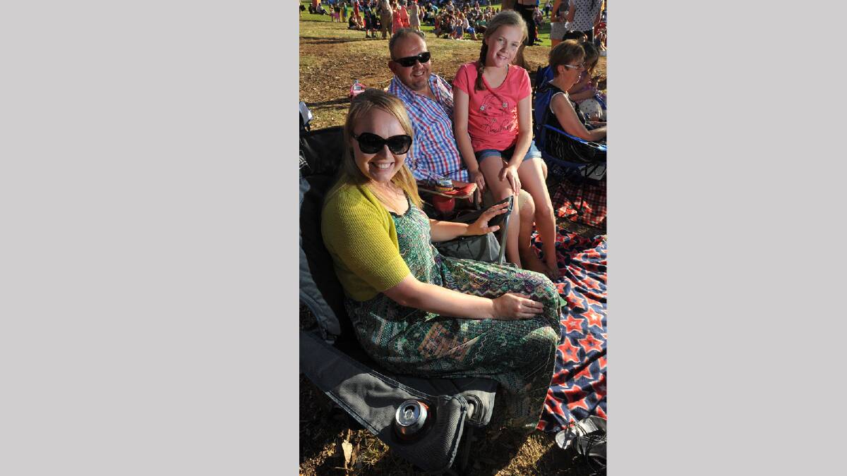 Heidi Freeland, Paul Snudden and Sophie Snudden, 11, at the Wagga Christmas Spectacular. Picture: Addison Hamilton