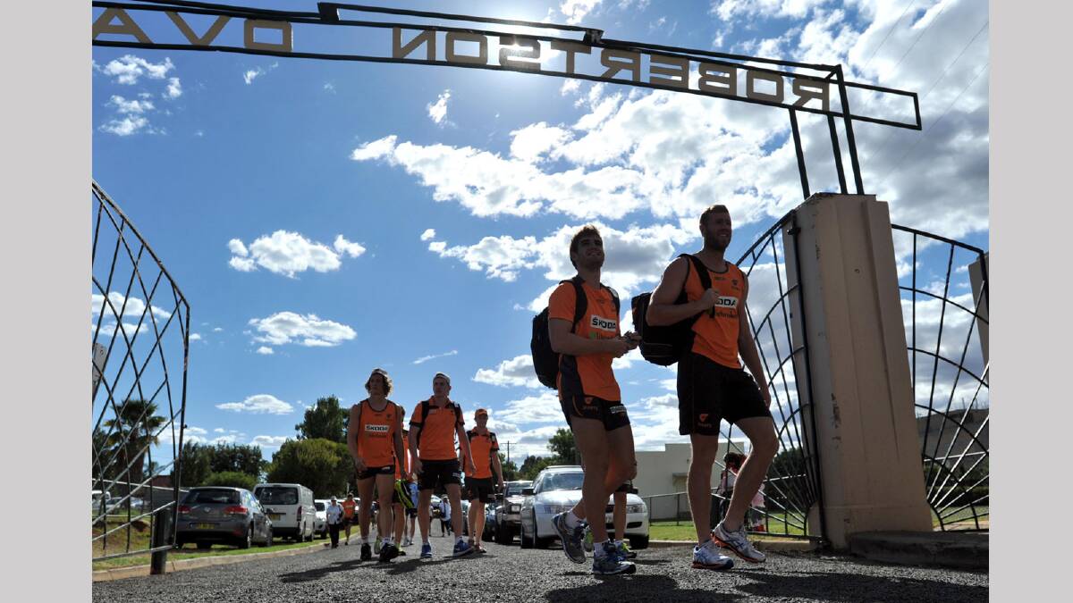 GWS players entering under the Robertson Oval gates. Picture: Les Smith