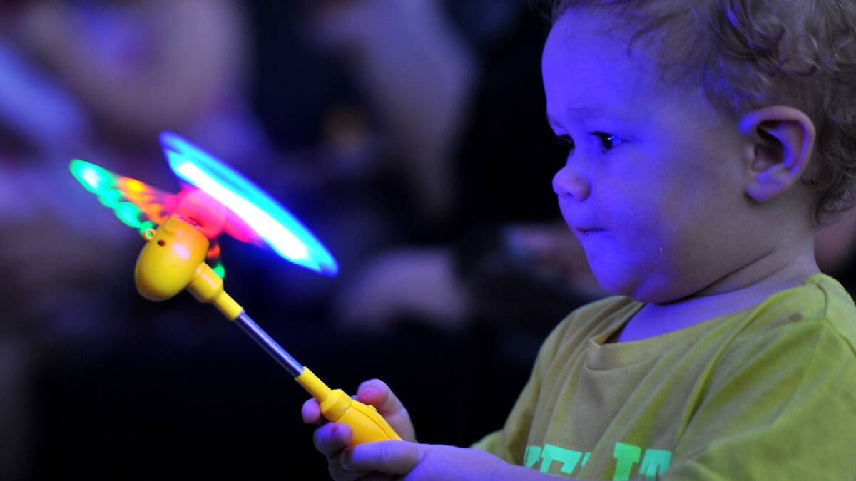 Ace Neeves, 1, is fascinated by the lights at the Wagga Christmas Spectacular. Picture: Addison Hamilton